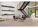 Modern entryway with staircase, contemporary decor, and abundant natural light at 507 Serenity Point Dr, Henderson, NV 89012