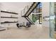 Entryway with modern staircase, glass-enclosed wine storage, and open floor plan at 507 Serenity Point Dr, Henderson, NV 89012