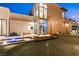 Modern home featuring a fire pit, putting green, and unique water feature in the front yard at 507 Serenity Point Dr, Henderson, NV 89012