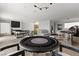 Spacious game room with poker tables and a lounge area for entertaining at 507 Serenity Point Dr, Henderson, NV 89012
