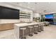 Modern kitchen with a large marble island, bar seating, and high-end stainless steel appliances at 507 Serenity Point Dr, Henderson, NV 89012