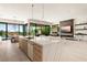 The kitchen features a waterfall island, modern appliances, and seamless access to the dining and living areas at 507 Serenity Point Dr, Henderson, NV 89012