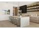 This gourmet kitchen boasts a spacious waterfall island, modern cabinetry, and an open layout perfect for entertaining at 507 Serenity Point Dr, Henderson, NV 89012