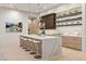 Modern kitchen featuring a waterfall island, stainless steel appliances, and ample cabinet space at 507 Serenity Point Dr, Henderson, NV 89012