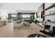 Bright, open living room features a modern fireplace, large windows, and stylish furnishings at 507 Serenity Point Dr, Henderson, NV 89012