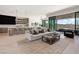 Open-concept living room with stunning views, modern decor, and seamless indoor-outdoor flow at 507 Serenity Point Dr, Henderson, NV 89012