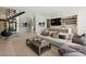 Bright and spacious living room with modern furnishings and a staircase at 507 Serenity Point Dr, Henderson, NV 89012