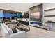 Sleek living room features a modern fireplace, built-in bar, and seamless indoor-outdoor living at 507 Serenity Point Dr, Henderson, NV 89012