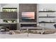 Modern living room with a fireplace and sleek shelving at 507 Serenity Point Dr, Henderson, NV 89012