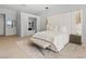 Serene main bedroom featuring a luxurious king bed, padded headboard and a spa-like bathroom retreat at 507 Serenity Point Dr, Henderson, NV 89012