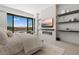The serene main bedroom offers natural light, scenic views, and a sleek fireplace feature at 507 Serenity Point Dr, Henderson, NV 89012
