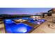 Luxury backyard pool featuring a fire pit, integrated lounge area, and scenic views, creating an ideal outdoor retreat at 507 Serenity Point Dr, Henderson, NV 89012