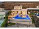 A backyard oasis with an infinity pool, outdoor kitchen, fire pit, and plenty of space for lounging and entertaining at 507 Serenity Point Dr, Henderson, NV 89012