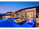 Stunning pool area featuring an integrated fire pit and lounge spaces, perfect for outdoor entertaining at 507 Serenity Point Dr, Henderson, NV 89012