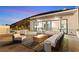 Rooftop patio with an outdoor fire pit, comfortable seating, ping pong table, and scenic hillside views at 507 Serenity Point Dr, Henderson, NV 89012