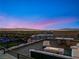 Enjoy breathtaking city views from this rooftop patio with a modern fire pit and stylish seating at 507 Serenity Point Dr, Henderson, NV 89012