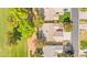Aerial view of the house showing the backyard, neighboring homes, and lush greenery at 5157 Future Dr, Las Vegas, NV 89130