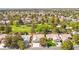 Beautiful aerial view of home in a golf course community with mature trees and landscaping at 5157 Future Dr, Las Vegas, NV 89130