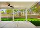 The backyard features artificial turf, a block fence, and a covered patio at 5157 Future Dr, Las Vegas, NV 89130