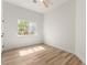 Bright bedroom featuring wood floors, a window with a view, and white walls at 5157 Future Dr, Las Vegas, NV 89130