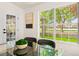 A dining area showing the well-manicured landscaping and large backyard through the large picture window at 5157 Future Dr, Las Vegas, NV 89130