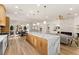 Spacious open-concept kitchen featuring a large island, modern appliances, and seamless flow into the living room at 5157 Future Dr, Las Vegas, NV 89130