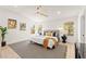 Bright bedroom with a modern ceiling fan, white walls, and natural light from the windows at 5157 Future Dr, Las Vegas, NV 89130