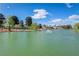 Picturesque pond with a fountain, surrounded by trees and landscaping at 5157 Future Dr, Las Vegas, NV 89130