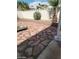 Backyard featuring red flagstone and a white block wall at 5243 Sunnywood Dr, Las Vegas, NV 89120