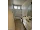 Bathroom with standard tub and shower, toilet and vanity at 5243 Sunnywood Dr, Las Vegas, NV 89120
