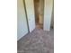 A bedroom with carpet, white walls and open access to the ensuite bathroom at 5243 Sunnywood Dr, Las Vegas, NV 89120