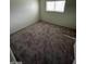 Bedroom with window and neutral carpet at 5243 Sunnywood Dr, Las Vegas, NV 89120