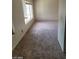 Bright bedroom with carpet, a window, and neutral colored walls at 5243 Sunnywood Dr, Las Vegas, NV 89120