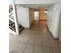 Spacious entryway with tiled floors, a staircase, and multiple doorways leading to other rooms at 5243 Sunnywood Dr, Las Vegas, NV 89120