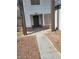 Close up of a home's exterior, featuring front door, desert landscaping, and rock features at 5243 Sunnywood Dr, Las Vegas, NV 89120