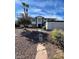 Inviting home featuring drought-resistant landscaping, desert flora, and a stone walkway leading to the entrance at 5243 Sunnywood Dr, Las Vegas, NV 89120