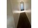 A long hallway with carpeted floor at 5243 Sunnywood Dr, Las Vegas, NV 89120