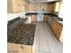 Kitchen with updated cabinets, countertops, appliances, and tile flooring at 5243 Sunnywood Dr, Las Vegas, NV 89120