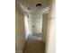 Bright laundry room with neutral walls, tiled floors, and shelving at 5243 Sunnywood Dr, Las Vegas, NV 89120