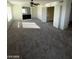 Spacious living room with carpet, ceiling fan, and a fireplace in the back at 5243 Sunnywood Dr, Las Vegas, NV 89120