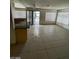 Open-concept living room and dining area with tile flooring and lots of natural light at 5243 Sunnywood Dr, Las Vegas, NV 89120