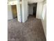 Bright living room with closet, bathroom access, and large window at 5243 Sunnywood Dr, Las Vegas, NV 89120