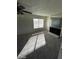 Carpeted living room area featuring a fireplace and ceiling fan at 5243 Sunnywood Dr, Las Vegas, NV 89120