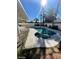 Relaxing backyard featuring a heated inground pool, spa and lush palm trees for private enjoyment at 5243 Sunnywood Dr, Las Vegas, NV 89120