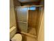 Shower with tiled walls and floor and glass door at 5243 Sunnywood Dr, Las Vegas, NV 89120