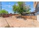 Spacious backyard with mature tree, providing ample space for outdoor activities and relaxation at 5505 Reiter Ave, Las Vegas, NV 89108