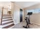 Basement access with workout equipment and view of dining room at 5505 Reiter Ave, Las Vegas, NV 89108