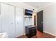 Bedroom features hardwood floors, a closet, and a television for your viewing pleasure at 5505 Reiter Ave, Las Vegas, NV 89108
