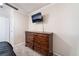 Bedroom featuring a television mounted above a large dresser with plenty of storage space at 5505 Reiter Ave, Las Vegas, NV 89108