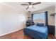 Bedroom with hardwood floors, a ceiling fan, and a window with a view of the neighborhood at 5505 Reiter Ave, Las Vegas, NV 89108